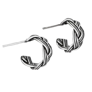 Pair of silver hoop earrings on a white background. It's A Wrap Sterling Silver Braided Hoop Earring at Rutledge Exchange