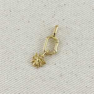 Gold  charm on a textured beige background Shop Rutledge Exchange for curated vintage and jewelry in Camden, SC.&nbsp;