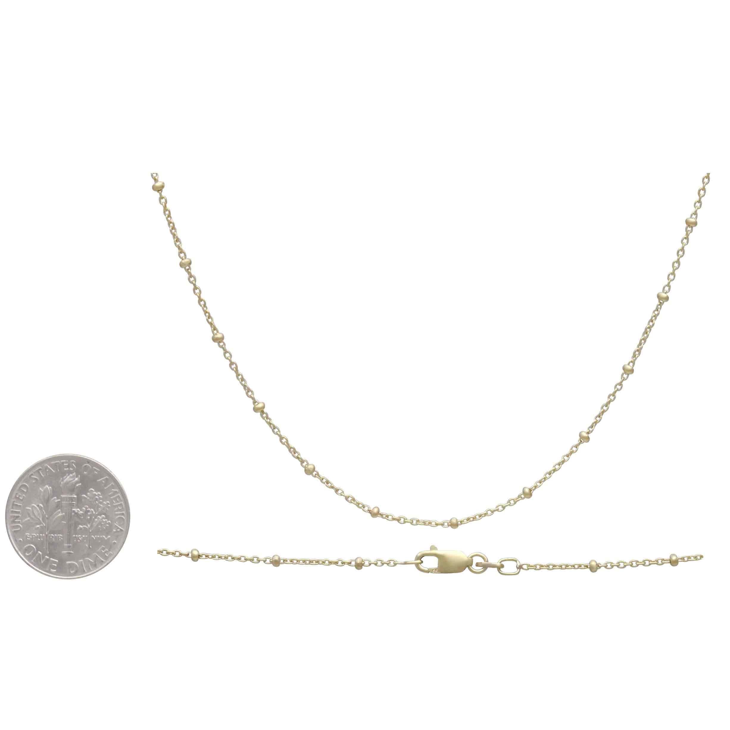 This gold filled satellite chain is perfect for creating charm necklaces. This curb chain feels lovely, each link is flatted and twisted to create a tightly linked sturdy chain. Each link measures approximately 2mm x 1mm and features a 8mm lobster clasp. This is a dainty satellite chain composed of tiny round links punctuated with gold beads that add a rich texture.  Wear on its own or with a charm. Perfect layering piece.