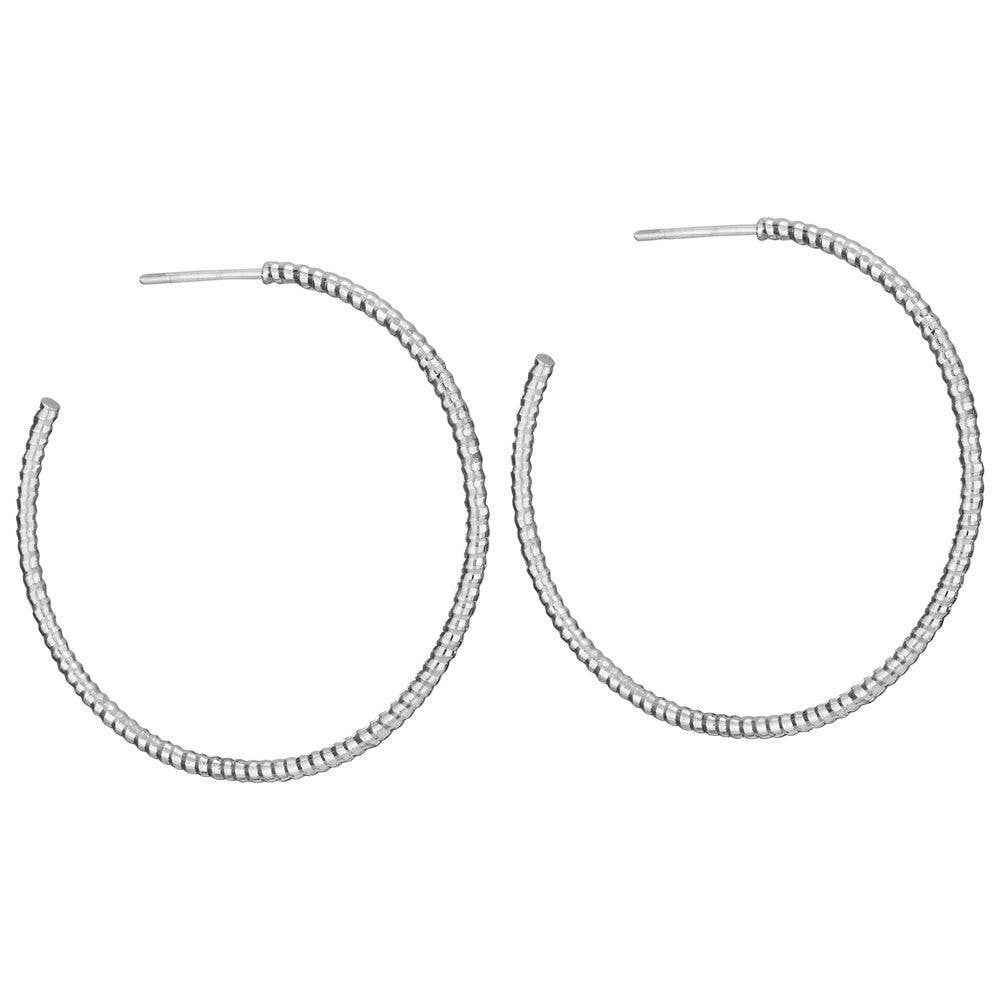 Silver hoop earrings on a white background. Buenos Aires Sterling Silver Hoop Earrings in Sterling Silver by Tiger Mountain Jewelry