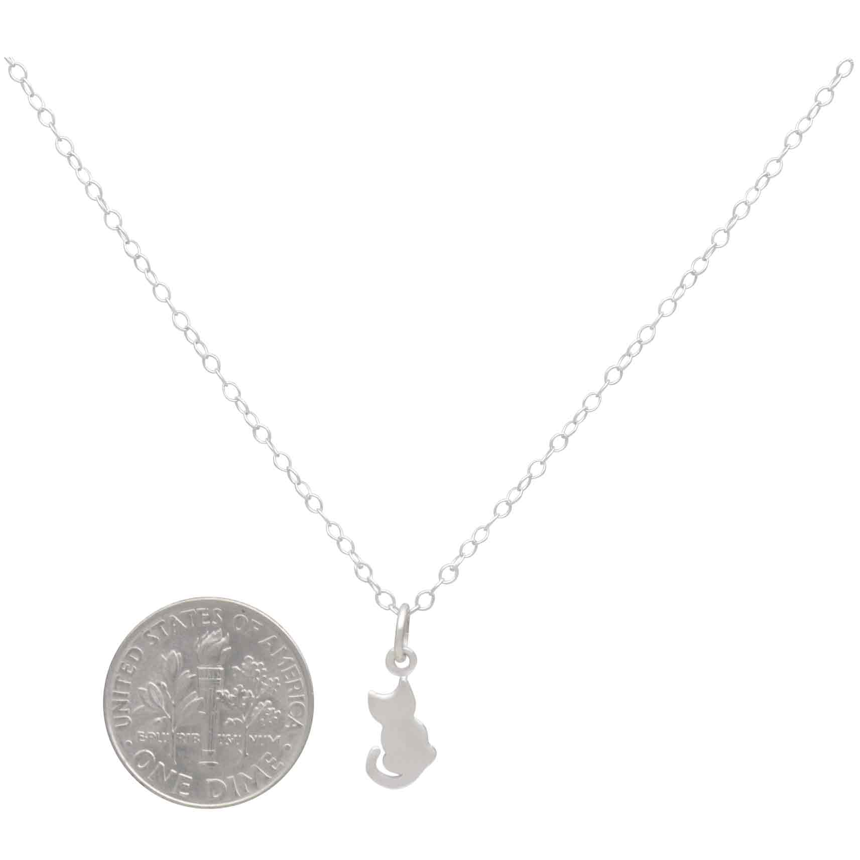 This sterling silver tiny cat charm necklace is a universal visual of a cat sitting patiently, just watching the world go by. We love her because she teaches us the joy of missing out, appreciating the little things, and of letting go of all our worry. While this tiny cat charm necklace is perfect for Youth and Jr Jewelry Lines, they'll also put a smile on cat lover's of all ages.