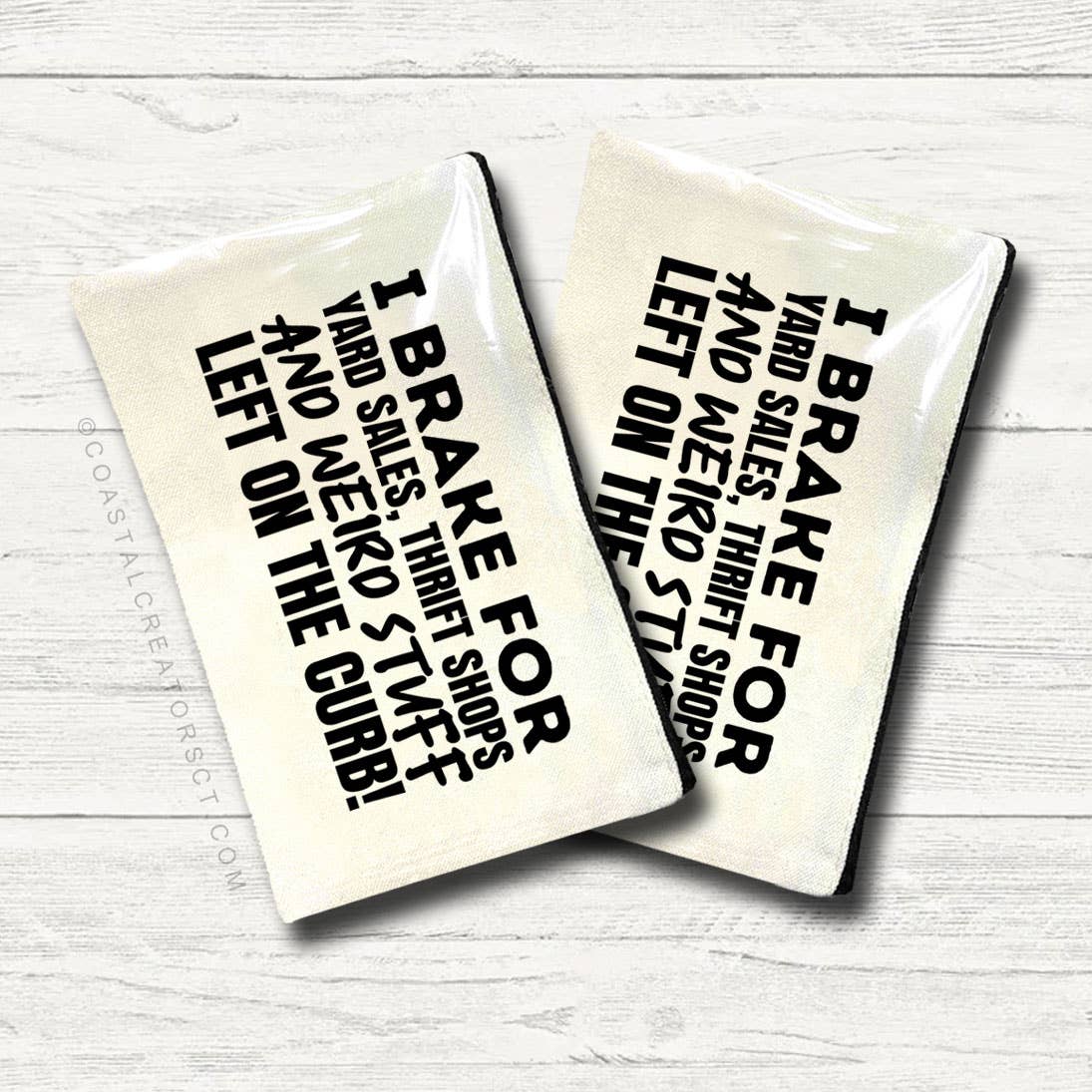 Two ceramic coasters with humorous text on a white wooden surface. Canvas pouch with text on a white wooden background at Rutledge Exchange in Camden, SC.