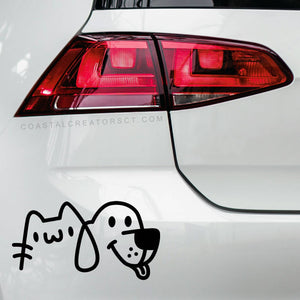 Car tail light with a cartoon dog and cat decal on a white car. Rutledge Exchange is a boutique jewelry and antique store in Camden, SC. &nbsp;
