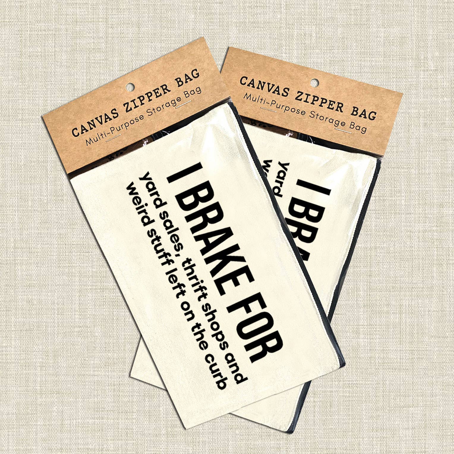 Canvas zipper bags with humorous text on a textured beige background. Canvas pouch with text on a white wooden background at Rutledge Exchange in Camden, SC.