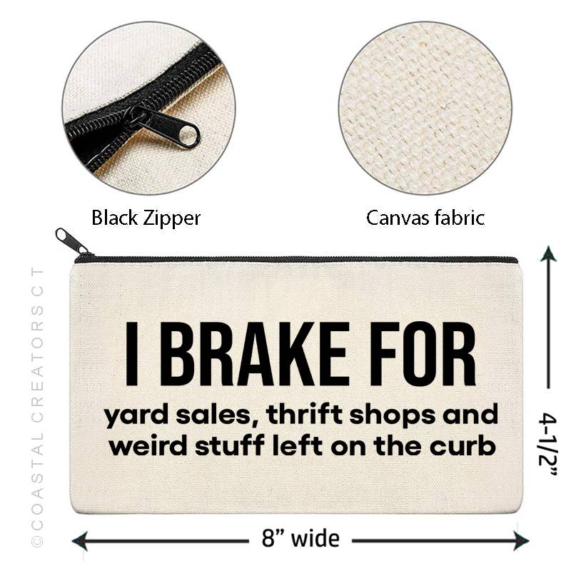 Canvas pouch with text 'I brake for yard sales, thrift shops and weird stuff left on the curb' featuring black zipper and fabric details.