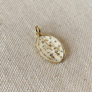 Gold pendant with star design on a beige fabric background. 
Shop Rutledge Exchange for curated vintage and jewelry in Camden, SC.&nbsp;

