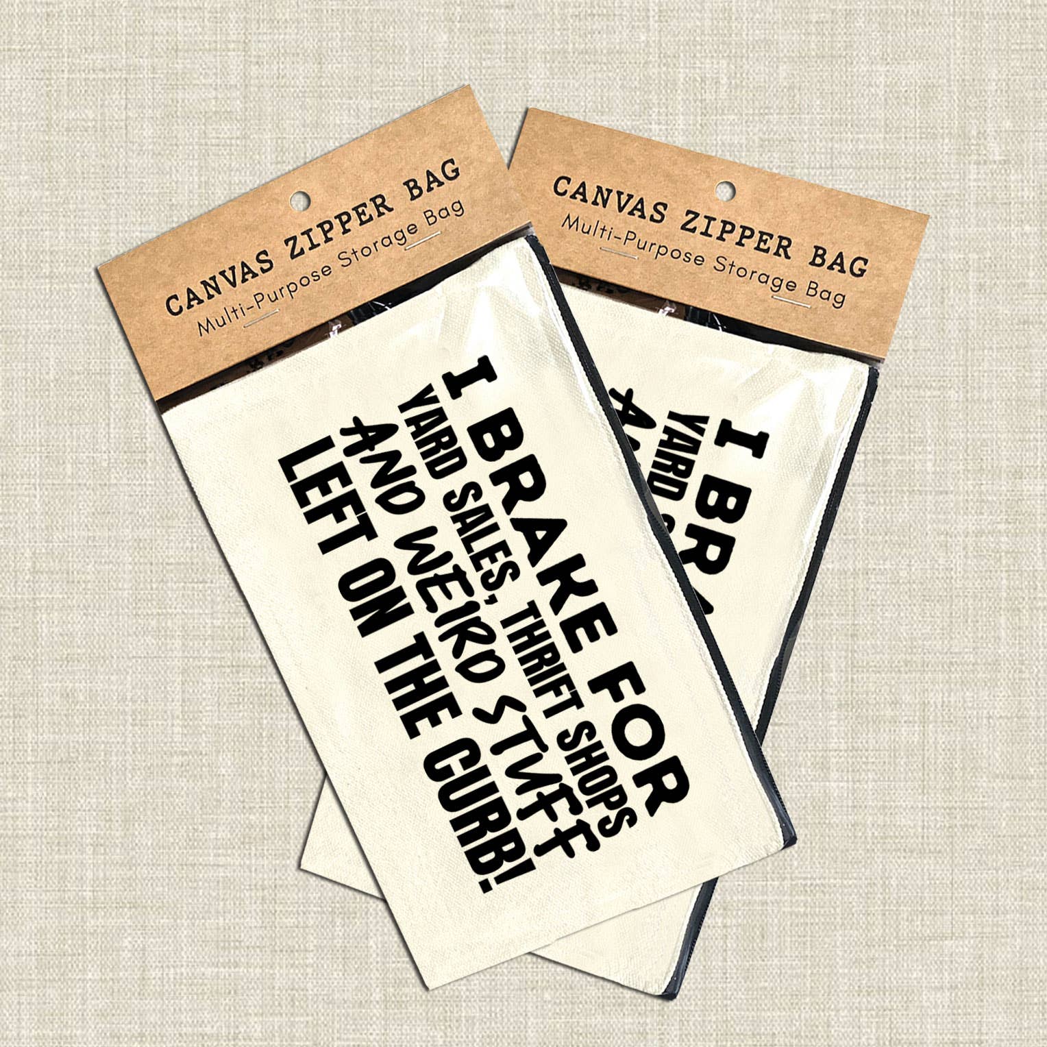 Canvas zipper bags with humorous text on a textured beige background. 