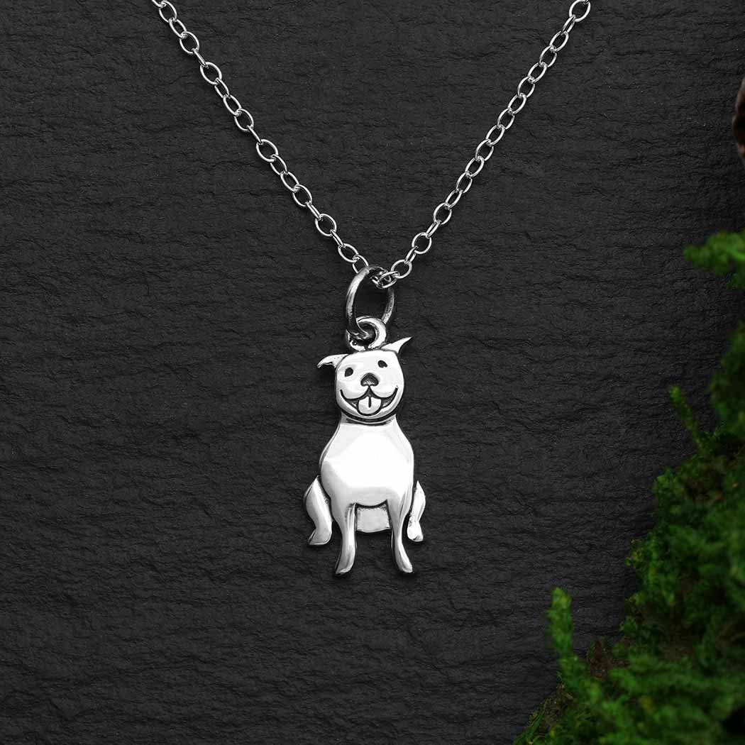 This sterling silver pitbull dog necklace showcases the friendly, dependable nature of bull dogs, highlighting it's lovable smile. This little doggie is ready to play.  Pitbull Necklace. Rescue Dog Jewelry at Rutledge Exchange in Camden SC