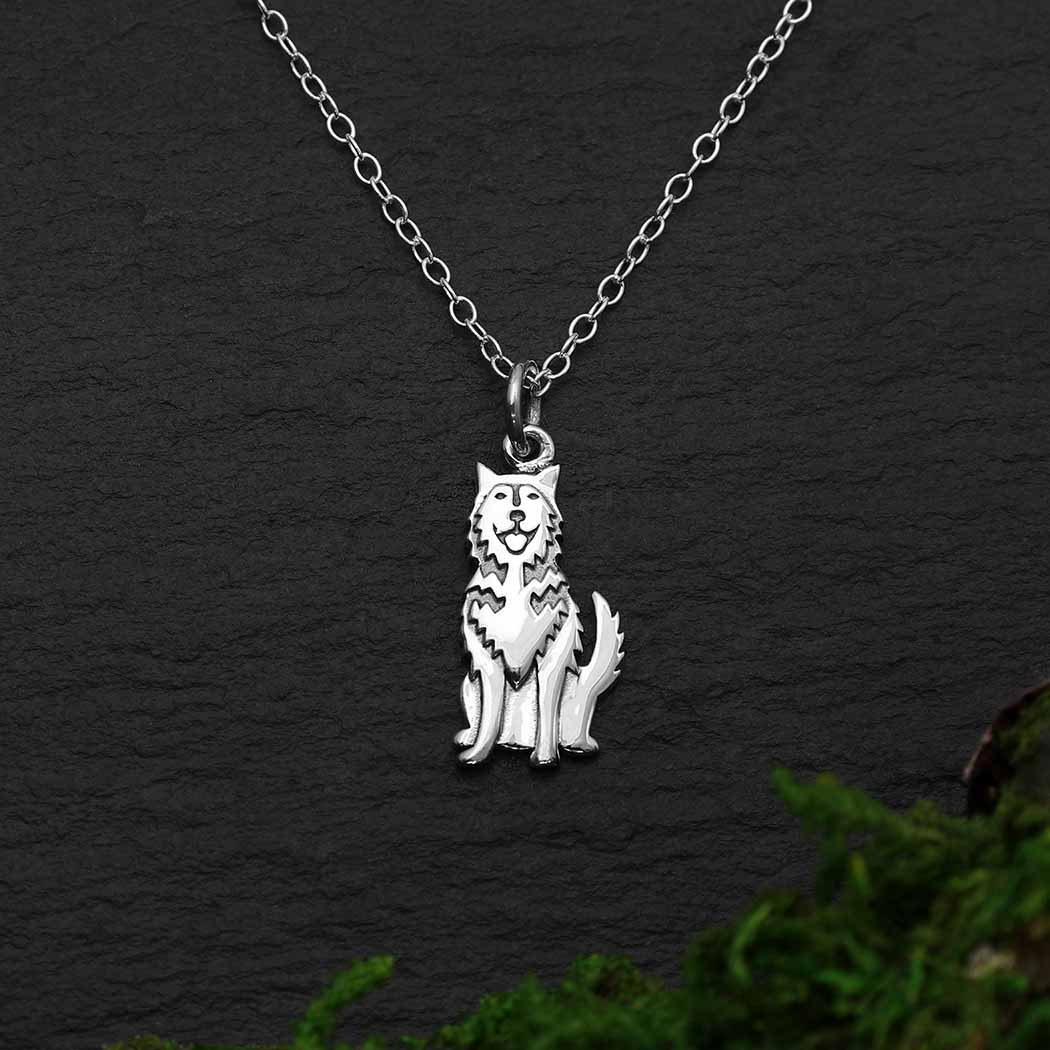 This sterling silver husky dog necklace showcases the breed's strength, and thick coat with distinctive markings. Bred for great endurance, huskies are famous for hauling sleds over great expanses of snow and ice. As born pack dogs, huskies thoroughly enjoy family life. In fact, their innate friendliness make them rather indifferent watchdogs.  Rutledge Exchange