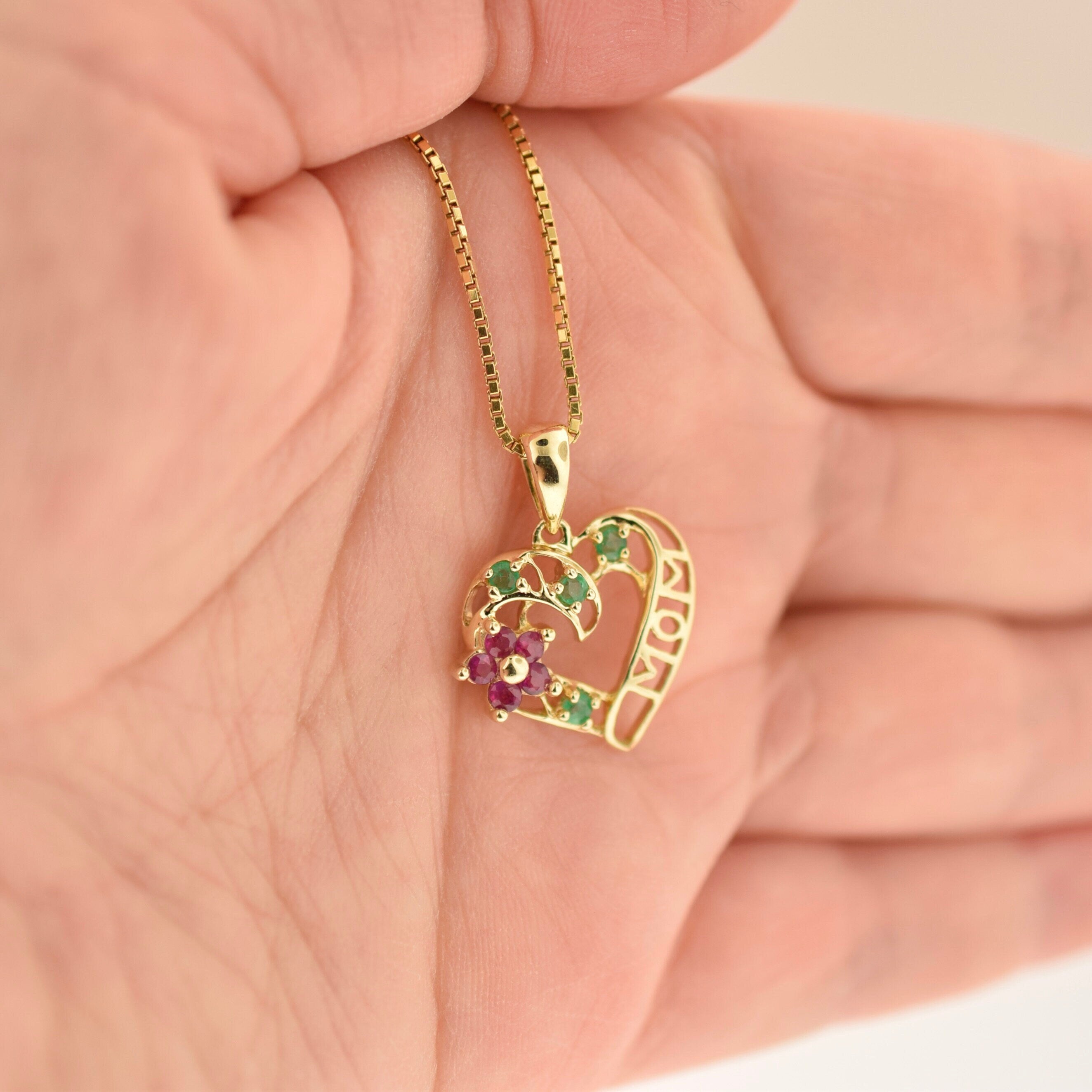 10k Yellow Gold Ruby Heart Mom Pendant. Rutledge Exchange is a Boutique Jewelry and Antiques Business in Historic Downtown Camden SC. We source regionally from Estate Sales, Dealers and Private Sellers.