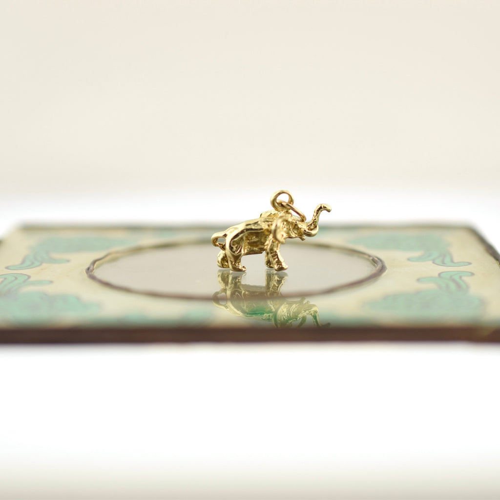Estate Sale find. Estate Sale Jewelry 10k Yellow Gold Elephant Charm for Charm Bracelet. Vintage Gold Elephant Pendant for Neck Mess. Gift for Charm Collector. Rutledge Exchange is a Boutique Jewelry and Antiques Business in Downtown Camden SC.